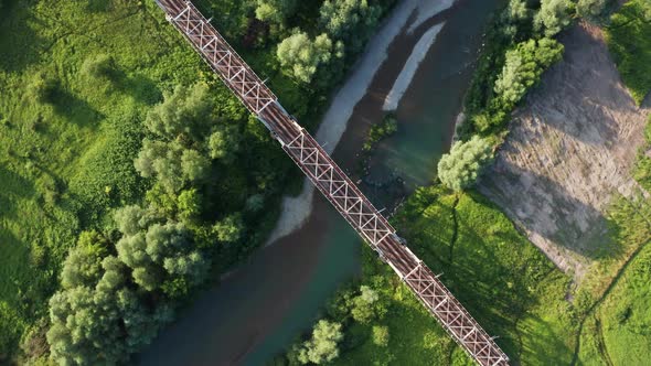 Train Moving on Bridge Above a River