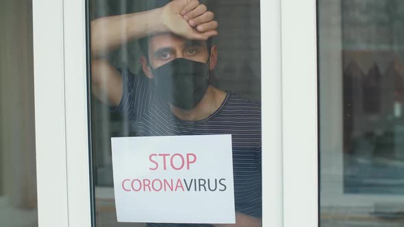 Man in a Protective Mask with the Inscription "Stop Coronavirus" alt