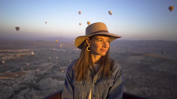 Happy Young Woman With Hat On Hot Air Balloon
