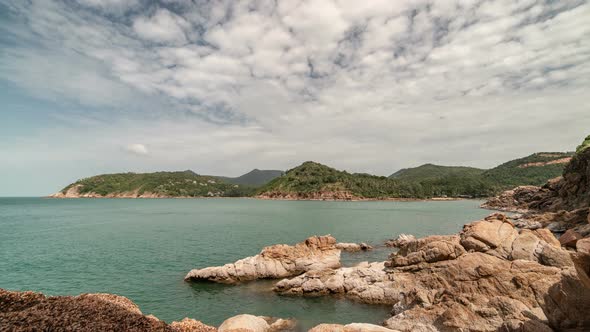 Beautiful rocky coast in the background of the sea and island Koh Phangan, Thailand alt