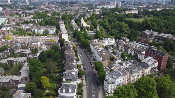 Primrose hill London , rising drone aerial reveal city skyline in distance alt