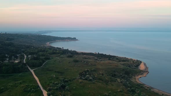 Aerial drone view of the Duruitoarea natural reservation in Moldova. River and fog in the air, hills alt
