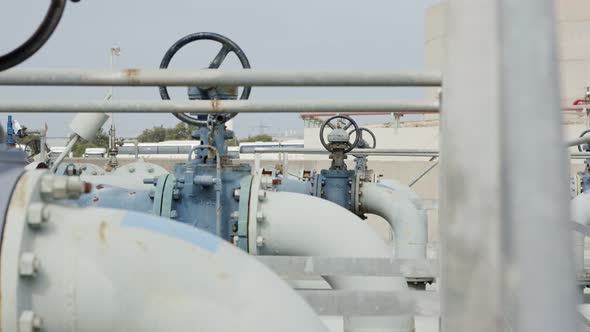 Oil and gas pipes and valves at a large oil refinery