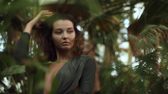 Woman Standing in the Tropical Jungle at Summer alt