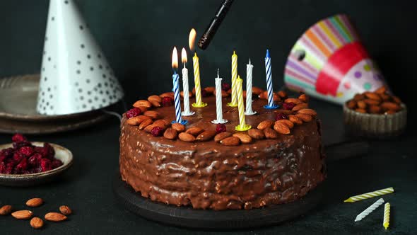 Chocolate birthday cake with candles. Party cake. Light candles. Make a wish