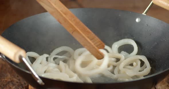 Frying the Squid Rings in a Frying Pan. 