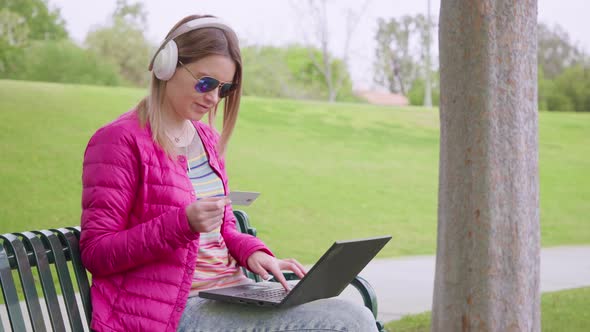 Happy Woman Shopper Using Easy Mobile Payments Making Purchase in Online Store alt