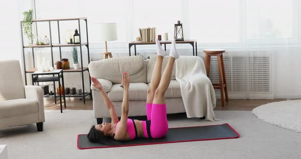 Black woman in sportswear doing workout fitness females aerobics sport fit at home.