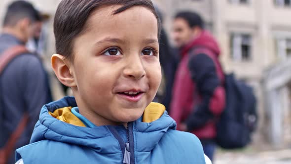 Smiling Refugee Boy Talking alt
