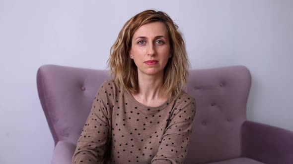 Confident smiling young adult european woman looking at camera standing at home office.