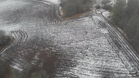 Stripe Pattern on Snow Covered Field Farm Concept Aerial