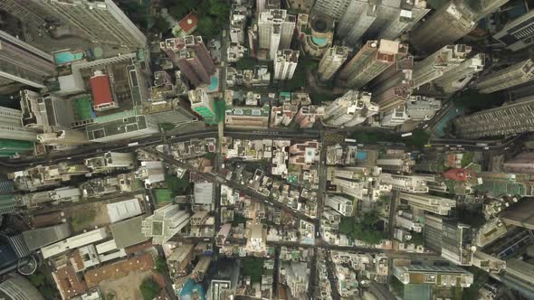 Static aerial top view of Hong Kong city with traffic flowing through alt