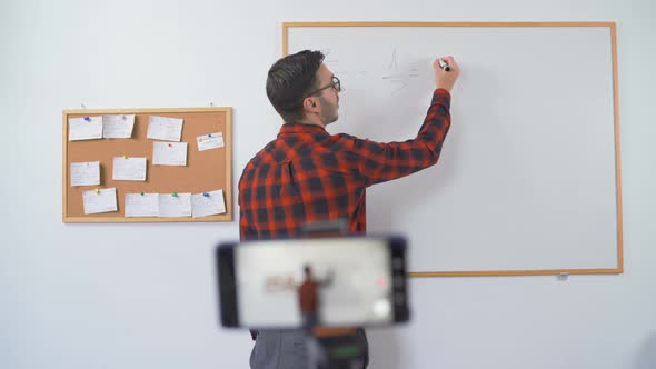 Bulgarian Maths Teacher During an Online Class, Talking To the Camera in Live Stream alt