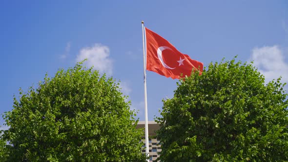 Turkish flag tied to a pole. alt