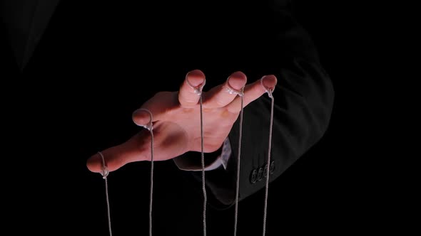 Hand of Dictator in a Business Suit with Strings on the Fingers To ...