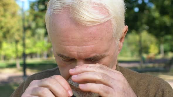 Caucasian Grey Bearded Man Wiping Tears Outdoors, Old Age Depression, Memories