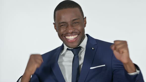Successful African Businessman Celebrating, White Background alt