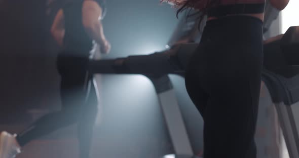 Close Up Buttocks of Athletic Woman Running on Treadmill in Fitness Gym Slow Motion alt