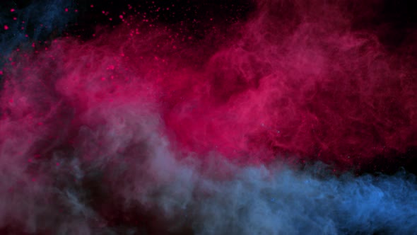 Super Slowmotion Shot of Color Powder Explosion Isolated on Black Background at 1000Fps. alt