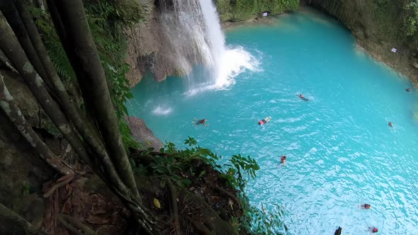 Tropical Waterfall in Rainforest. Kawasan Falls on Cebu Island in Philippines alt