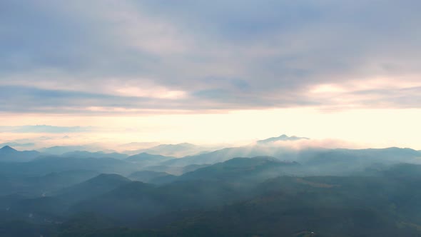 4K Aerial view of Mountains landscape with morning fog. alt