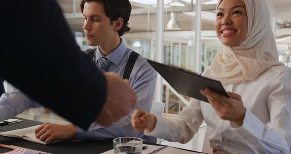 Greeting an arrival at a business event alt