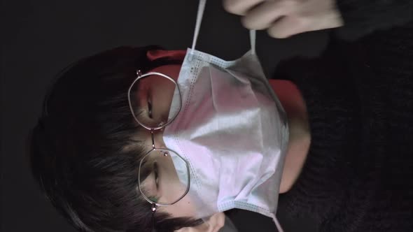 Vertical Shot Asian Man in Glasses Wearing Medical Mask Against 2019nCov