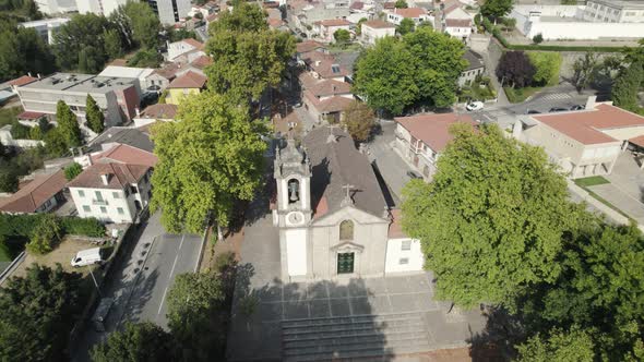 Drone pan showing historic Church of St. Damasus; Guimaraes