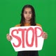 Frustrated Depressed African American Teenage Girl Showing Stop Message Banner Looking at Camera - VideoHive Item for Sale