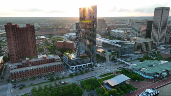 Skyscraper towers in Baltimore Maryland. Inner Harbor pullback aerial reveal. alt