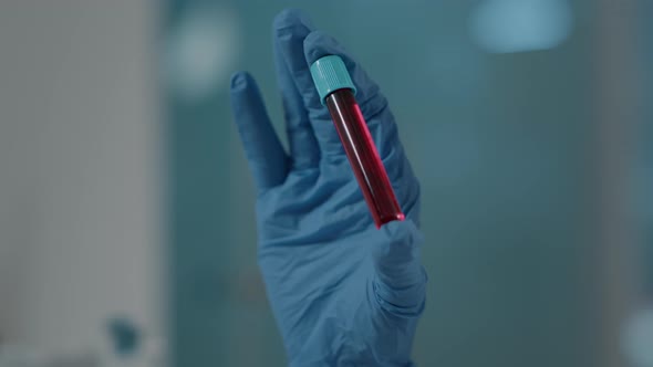 Scientist Holding Test Tube with Dna Substance in Laboratory alt