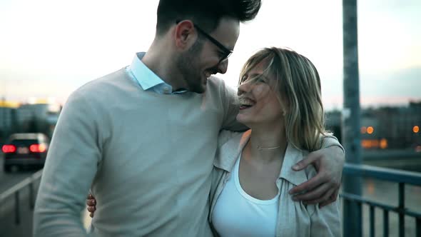 Romantic Couple in Love Hugging Kissing Outdoor in Sunset