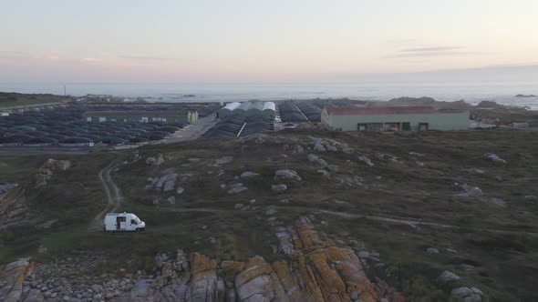 Amazing drone aerial landscape view of a Sea farm on land at sunset in Galiza, Spain alt