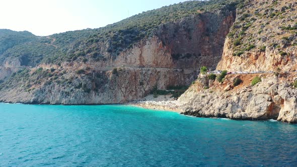 Aerial drone panning in at Kaputas Beach in Kas Turkey on a sunny afternoon day during summer as Eur alt