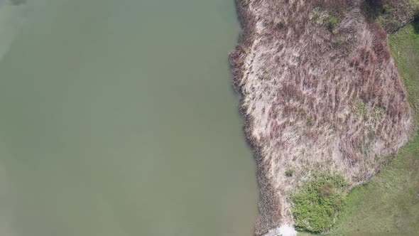 Aerial Rotating View Of The Lake And Land