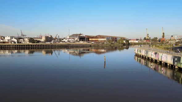 Old Port District with dilapidated buildings on banks of Matanza River; La Boca, Buenos Aires alt