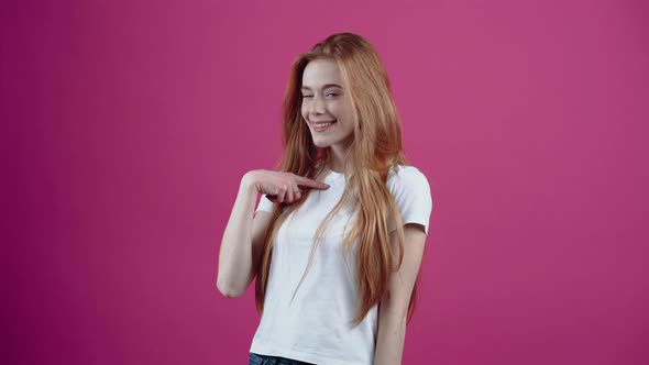 The Happy Young Woman Points Her Index Finger at Her and Says Gratefully Me alt