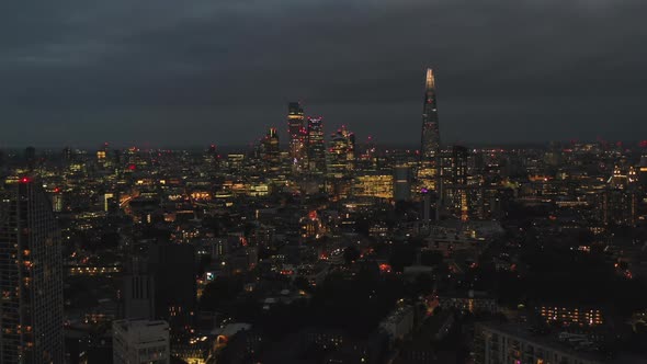 Backwards Fly Above Night Cityscape alt