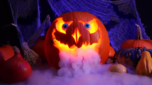 Halloween pumpkin Jack o lantern with heavy smoke. Autumn spooky decoration.