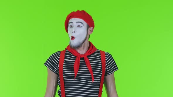 Mime Man Dresses A Mask On A Green Background