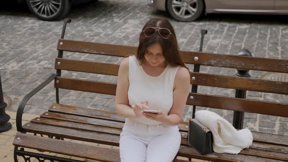 Young Woman Uses Smartphone