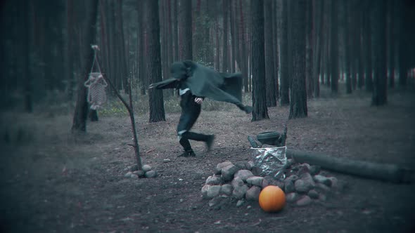 Terrible dark figure run in the forest. Scene for Halloween