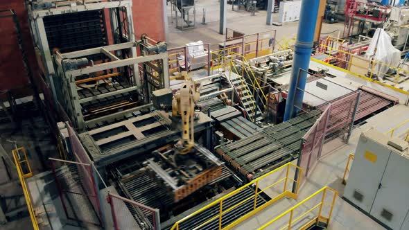 Automatized Machine Is Transporting Ceramics at Modern Industrial Factory Line alt