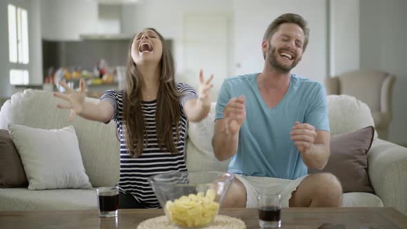 Pissed off Fan Couple at Home alt