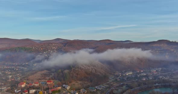 Majestic View of Morning Mountain Village with Covered Fog alt