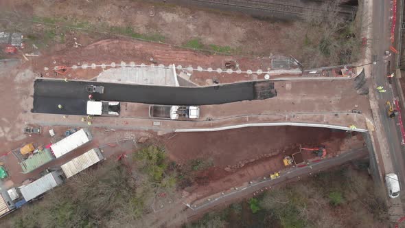 Heavy Plant Machinery Tarmacing Road On Bridge Construction Site, Bird's Eye View, Cine D.