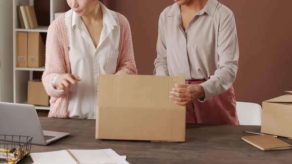 Women Packing Order from Online Clothes Shop alt