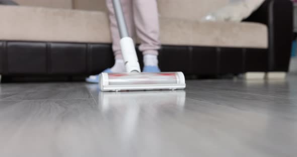 Cleaning with Cordless Vacuum Cleaner Floor of House
