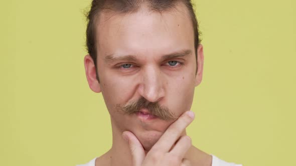 Closeup Serious Caucasian Young Man Planning Some Idea Touching Chin with Strong View alt