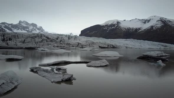 Flying above quiet glacier on a cloudy day